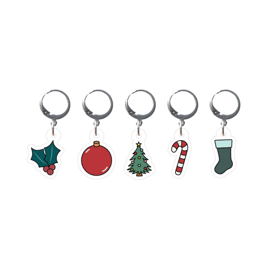 Set of five Christmas-themed stitch markers on a white background