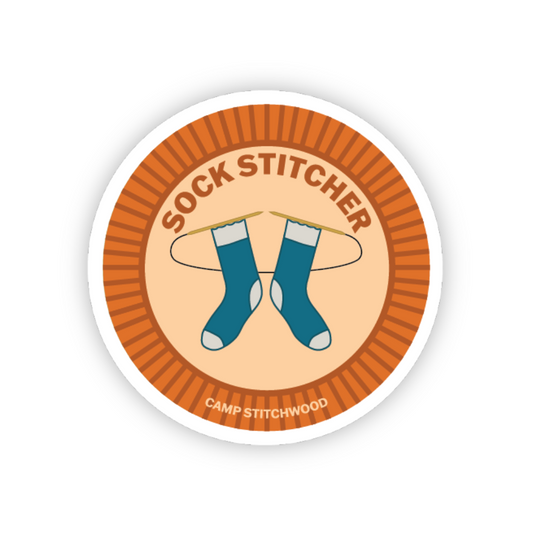 Circular sticker with 'Sock Stitcher' text and blue socks on a white background
