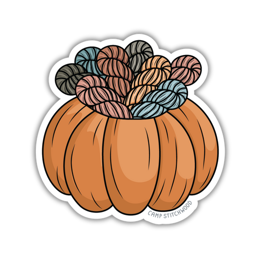 Pumpkin-shaped container with yarn on top