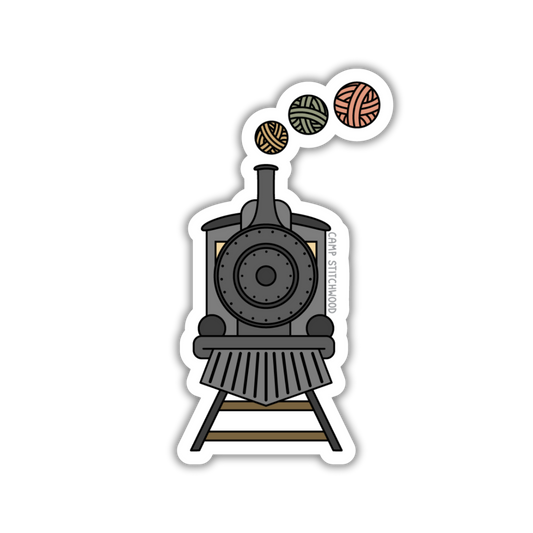Sticker of a steam locomotive with yarn balls on a white background