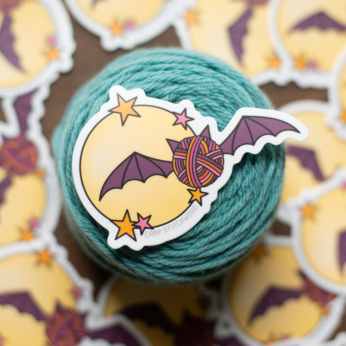 Yarn ball with a bat and moon sticker on a cake of yarn