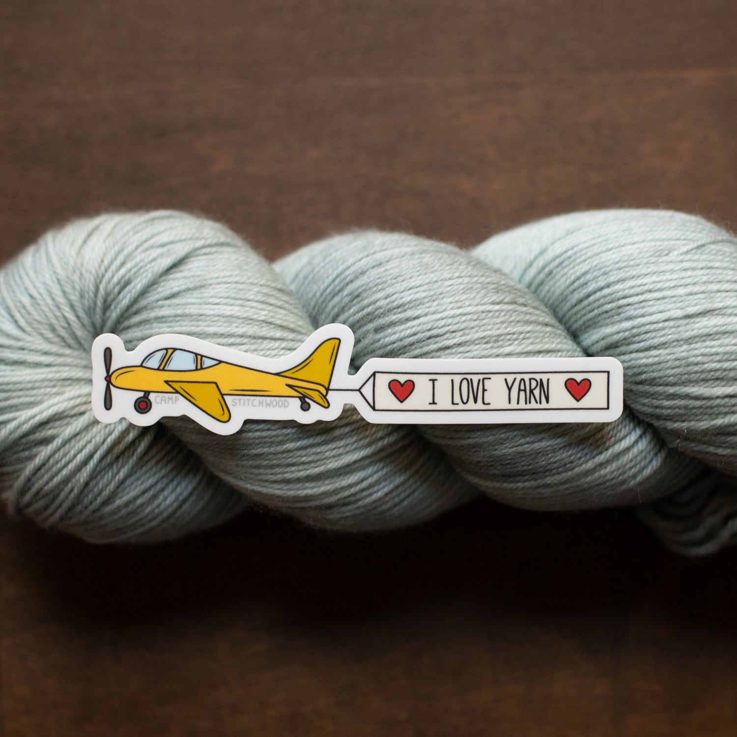 Airplane Sticker with Banner that says I love yarn