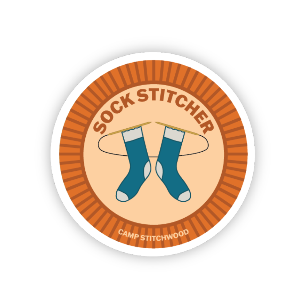 Circular sticker with 'Sock Stitcher' text and blue socks on a white background