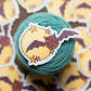 Yarn ball with a bat and moon sticker on a cake of yarn