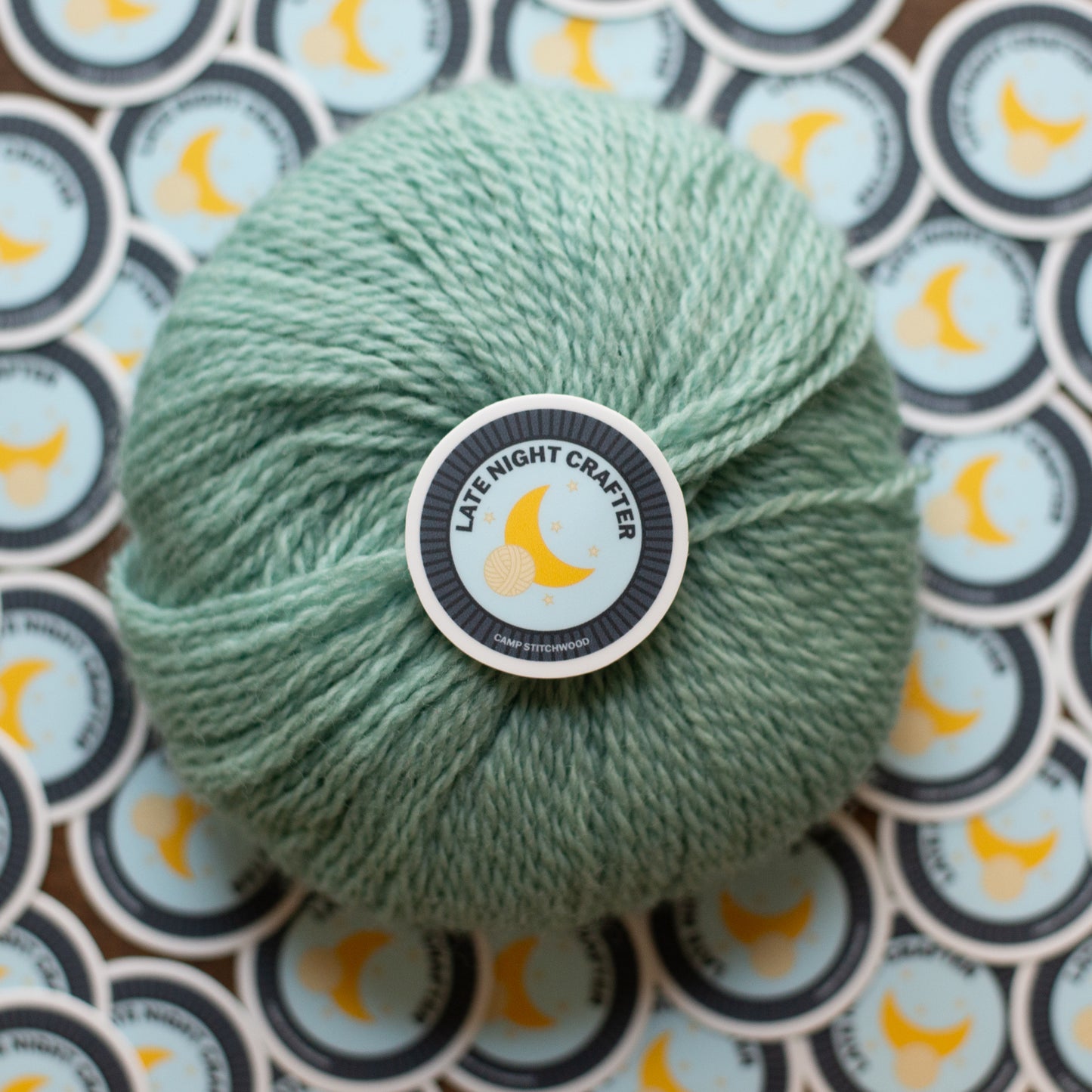 Green skein of yarn with a 'Late Night Crafter' label on a patterned background
