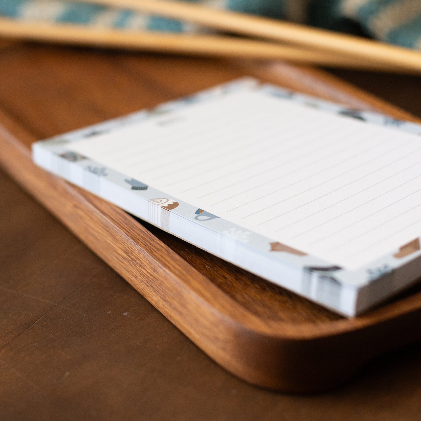Notepad sideview on a wooden tray