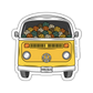 A die-cut vinyl sticker featuring a retro yellow Volkswagen Type I bus filled with colorful knitted yarn balls, shown on a plain white background.