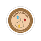 Circular sticker with 'Yarn Crawler' design and 'Camp Stitchwood' text on a white background