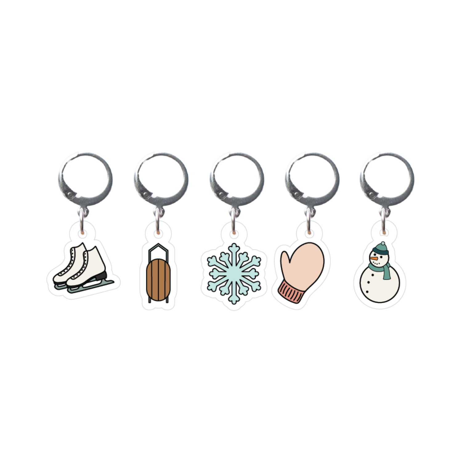 Set of five winter-themed stitch markers on a white background