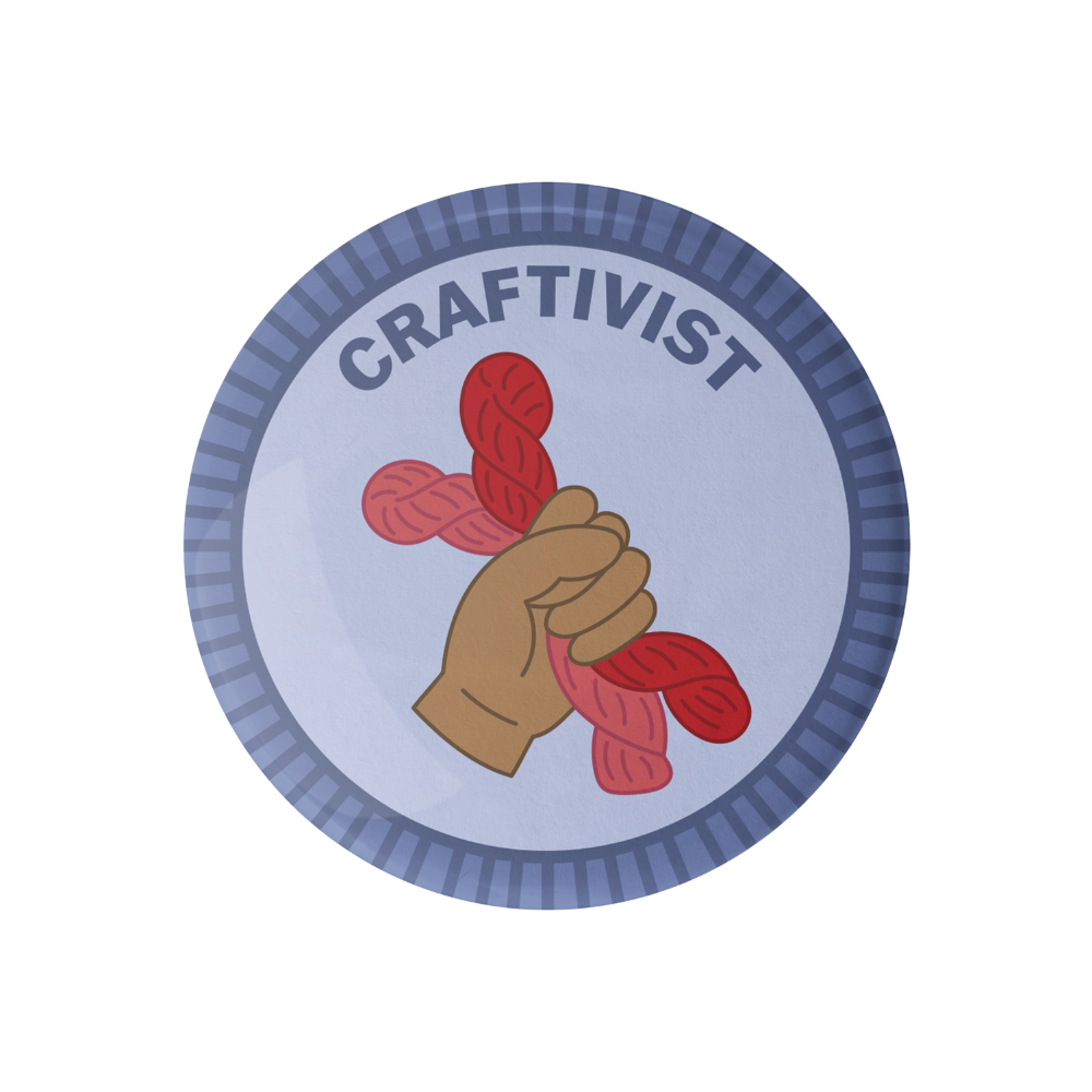 Circular badge with a hand holding red yarn, labeled 'Craftivist' on a white background.