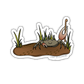 Sticker of a crab in the mud with grass, featuring 'Camp Stitchwood' text.