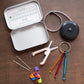 The fiber first aid kit will the contents laid out on a table