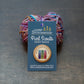 Indie Dyed Investor badge on a card stock backer