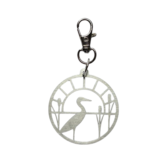 Silver stitch marker holder with a heron design on a white background