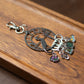 Metal stitch marker holder with stitch markers attached