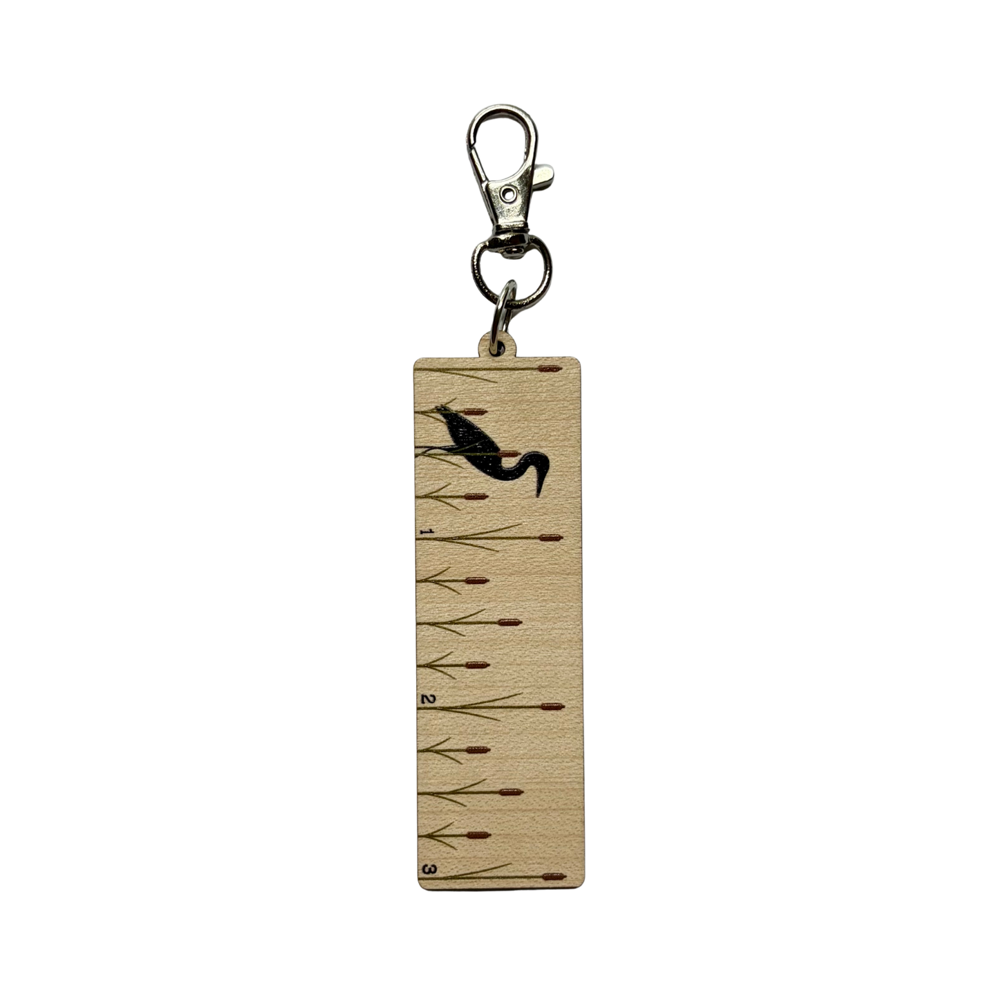 Clip on ruler with a design of heron and cattails