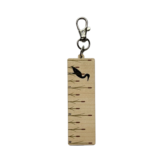 Clip on ruler with a design of heron and cattails