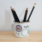 The Purl Scouts Camp Mug with pencils in it