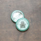 Retreat Relaxation badge on top of an upside down badge