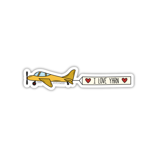 Sticker of a yellow airplane with 'I Love Yarn' text on a white background