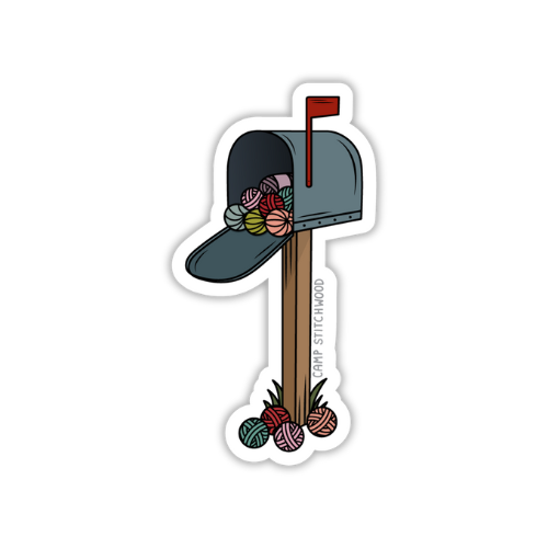 Sticker of a mailbox with yarn balls on a white background
